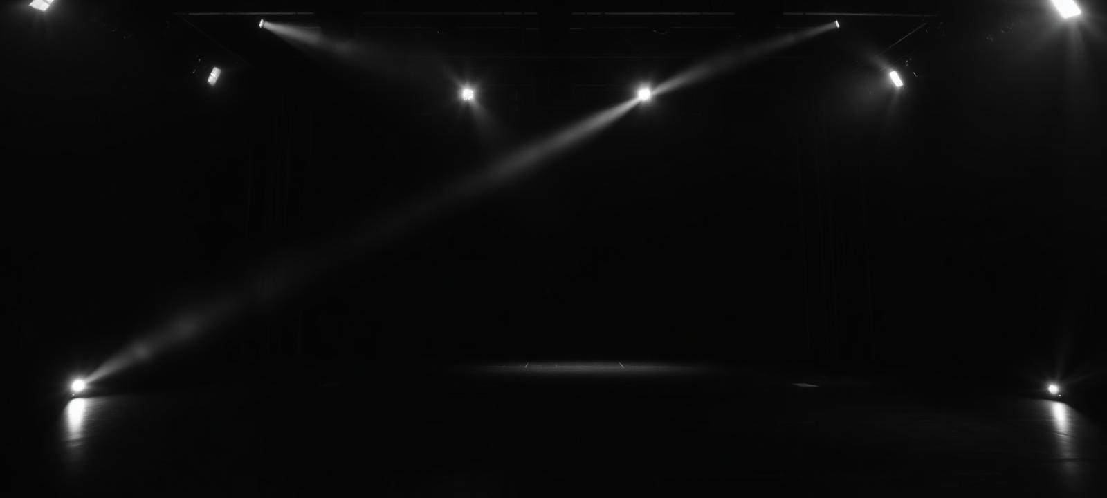 Empty dark soundstage lit by a single beam